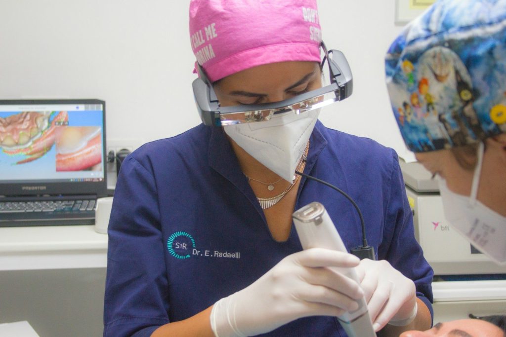 a doctor using a stethoscope on a patient's neck